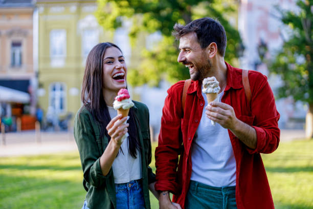 istock Laughing couple with ice cream cones 2157475256