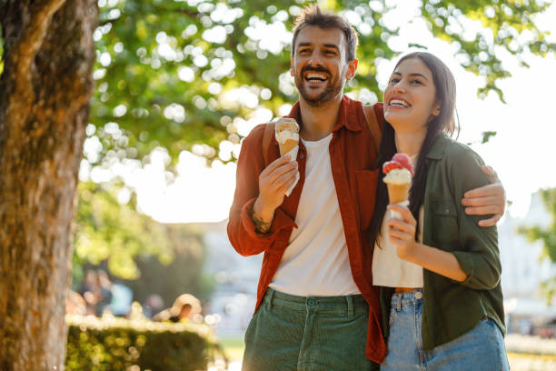 istock Couple enjoying ice cream on a sunny day 2157475344
