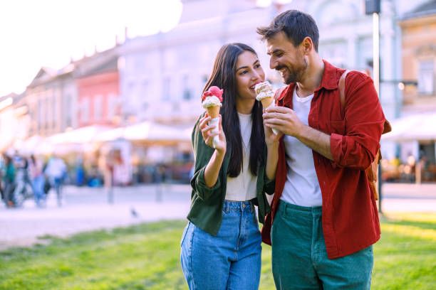 istock Smiling couple with tasty ice creams 2157475388