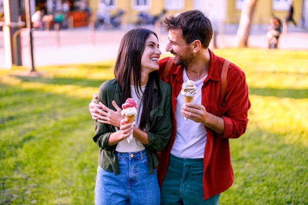 istock Couple closely embracing with ice cream cones 2157475462