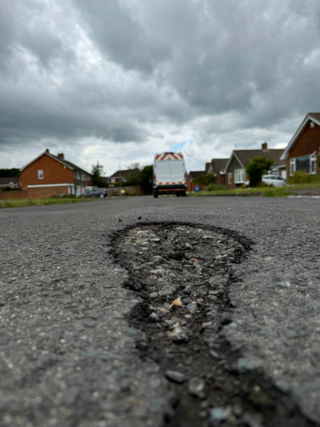 Repaired circular section of an asphalt road.