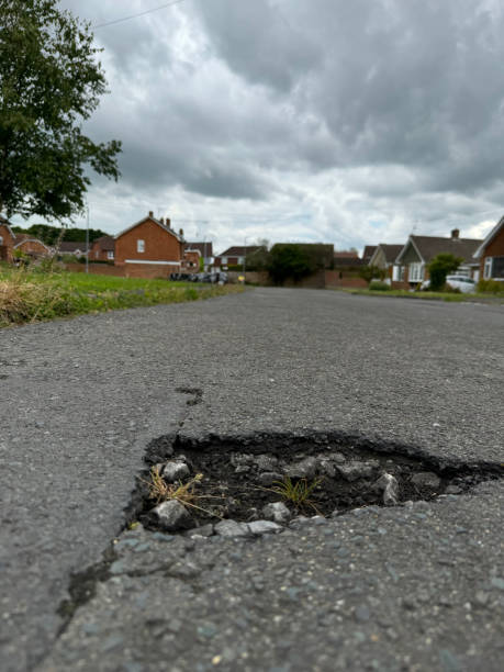 istock Potholes In A Residential Area 2 2157477788