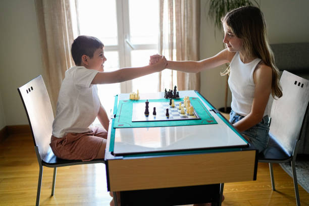 istock A boy and a girl are playing chess 2157478186