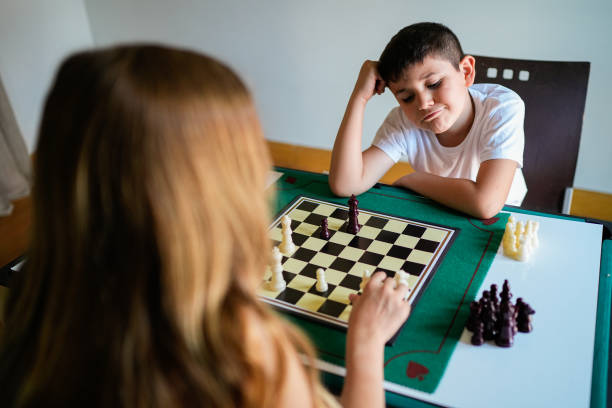 istock A boy and a girl are playing chess 2157478249