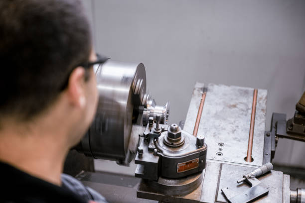 istock Industrial worker works on a metalworking machine 2157481790