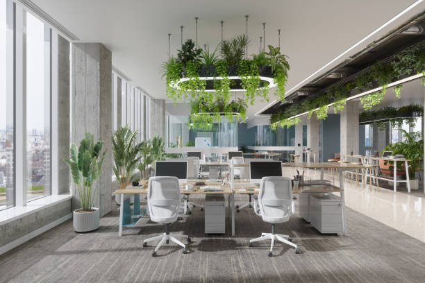 istock Eco-Friendly Co-Working Office Space With Computers, Office Tables, Chairs And Creeper Plants 2157482368