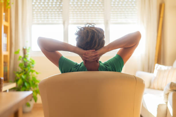 istock Persona Relaxing On A Couch At Home 2157482497