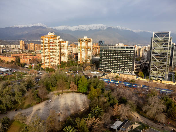 istock Modern buildings in front of a public park at sunset 2157484724