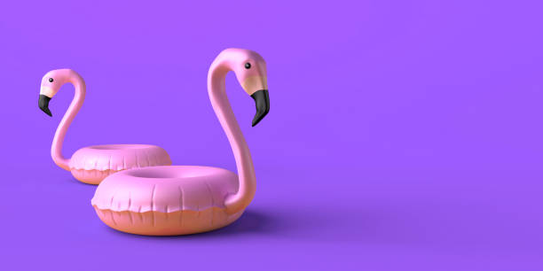 istock Summer concept with flamingo inflatable floats on yellow background. Copy space. 3D illustration. 2157485040