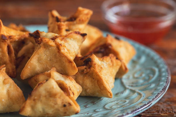 Crispy fried wontons stuffed with a delicious filling made of cream cheese and crab meat