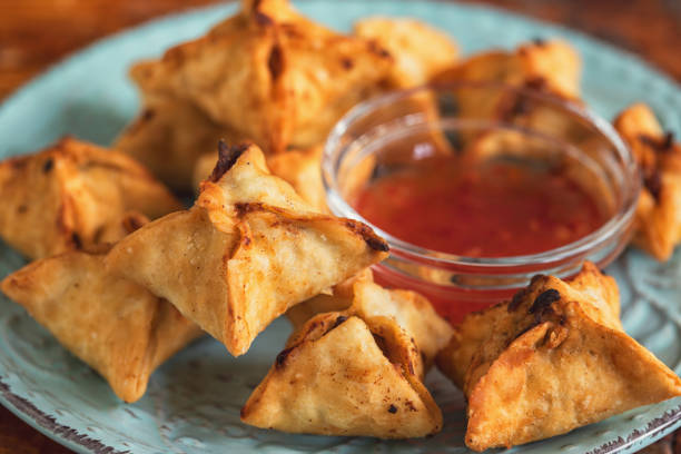Crispy fried wontons stuffed with a delicious filling made of cream cheese and crab meat