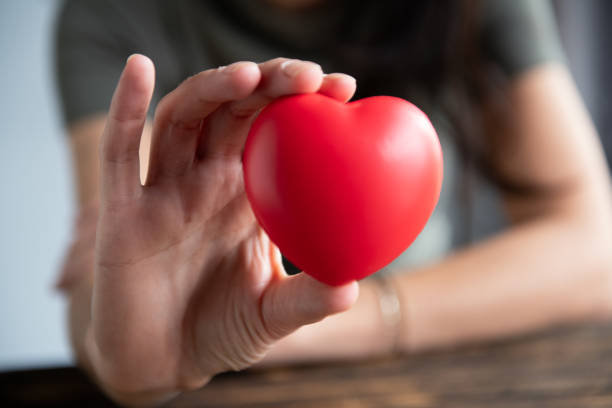 istock The woman is holding a red heart 2157486055