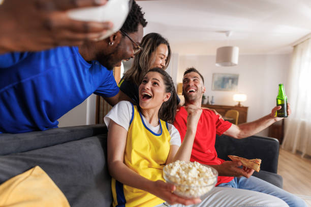 istock Multi-ethnic friends celebrating a win of their soccer team 2157486552
