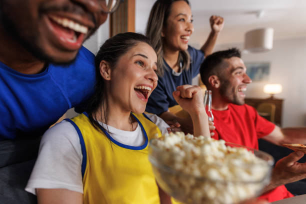 istock Cheerful friends supporting their team. We are so proud! 2157486565