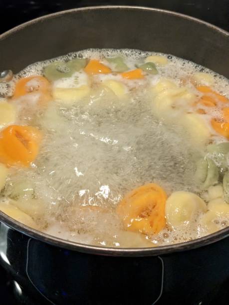 istock Tri-colored tortellini boiling in a pot 2157486838