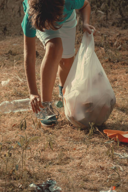 istock A boy doing volunteer nature cleaning. 2157486865