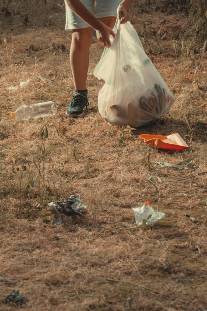 istock A boy doing volunteer nature cleaning. 2157486870