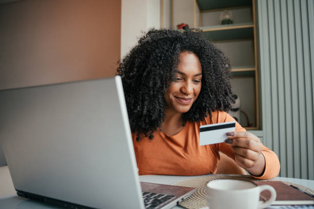 Young woman making online purchase with credit card