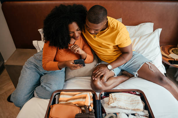 istock Couple packing for vacation trip 2157490128