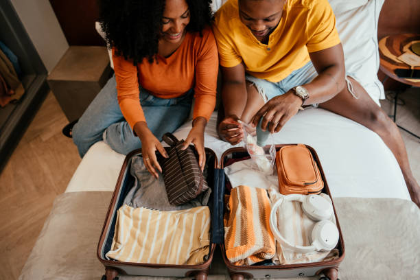 istock Couple packing for vacation trip 2157490142