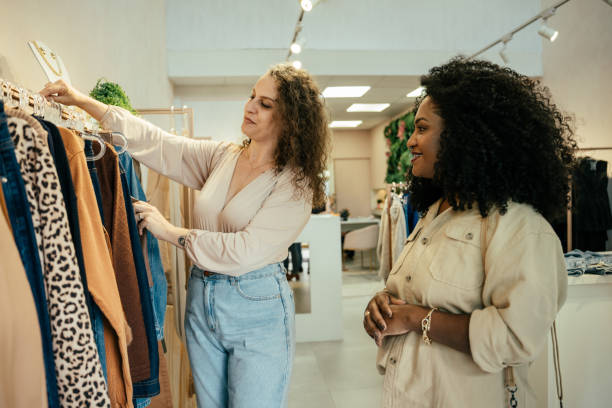 istock Black woman looking at clothes in a store 2157490845
