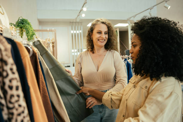 istock Black woman looking at clothes in a store 2157490856