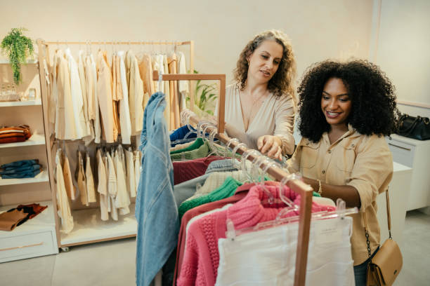 istock Black woman looking at clothes in a store 2157490867
