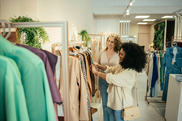 istock Black woman looking at clothes in a store 2157490868