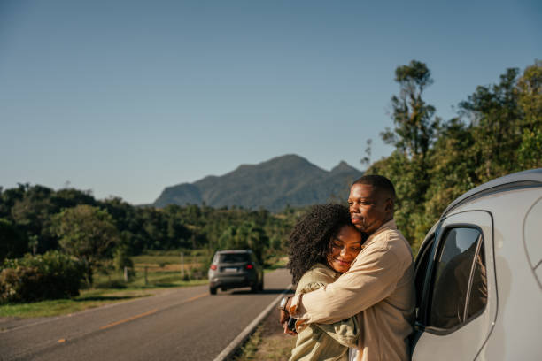 istock Couple hugging by the car 2157491747