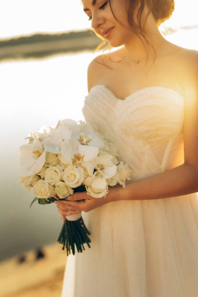 istock bride against the background of a yellow sunset 2157494889