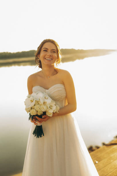 istock bride against the background of a yellow sunset 2157495299