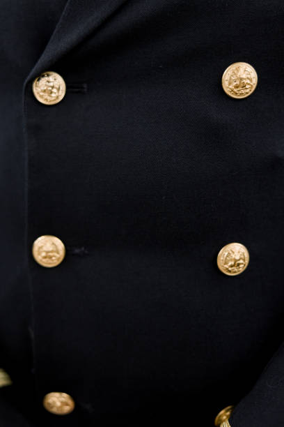 Close-up of gold buttons on a military officer's uniform
