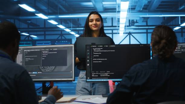 istock Happy team leader coordinating employees checking data center bottlenecks 2157497562
