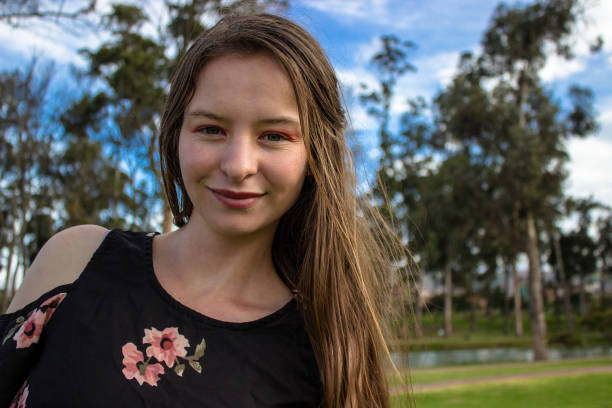 Beautiful young woman posing in the nature in a public park in Bogota