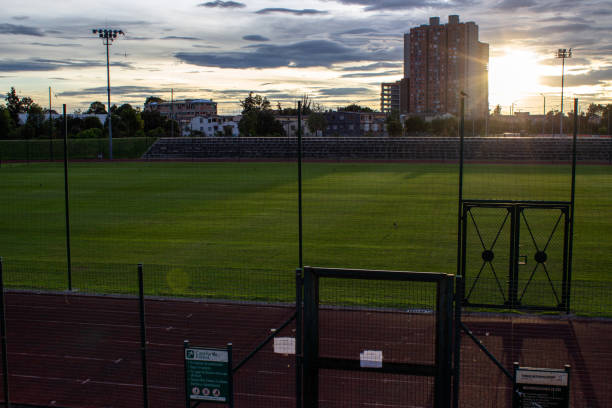 Soccer field next to an athletics track at sunset in Bogota