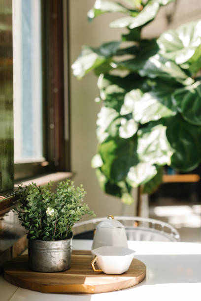 istock Teacup on a wooden table by the window 2157504156