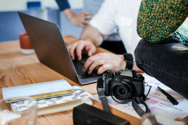 istock Photographer having a meeting in the office 2157504281
