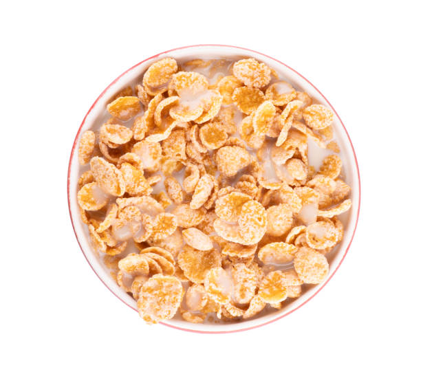 istock bowl of cornflakes breakfast cereal with sugar milk top view isolated 2157504797