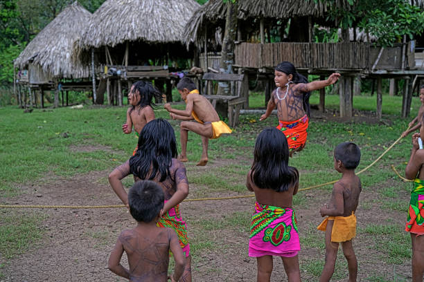 Children playing on 09-14-2017 at Laurel, Embera Wounaan indigenous community located about 250 km from the capital city of Panama, in the Darién jungle on the banks of the Lara river.Some 45 people decided to found this small community with the hope of conserving their customs and traditions. The same expects to subsist in agriculture and fishing as it has always been but with the hope of being able to receive visitors who want to live with them their traditions and the sale of their crafts.The Embera-Wounaan are a people who live and work around rivers. They build their canoes (pirogues) with espavé wood, hawthorn cedar and yellow pine. The indigenous people are excellent goldsmiths and wood carvers. Women make basketry items; baskets, mats and decorations.