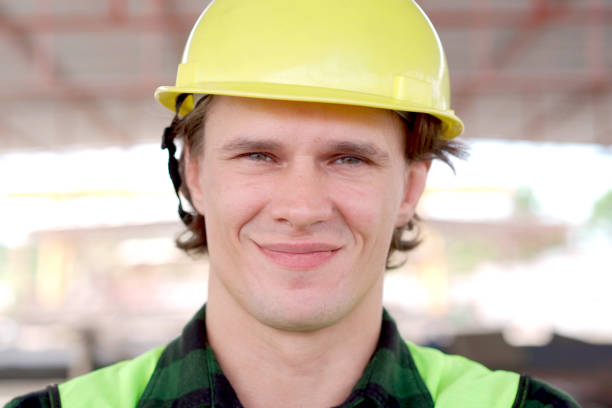 Male caucasian ethnicity civil engineer working at the construction site, engineer considering about the construction plan. Civil engineer is working on site.