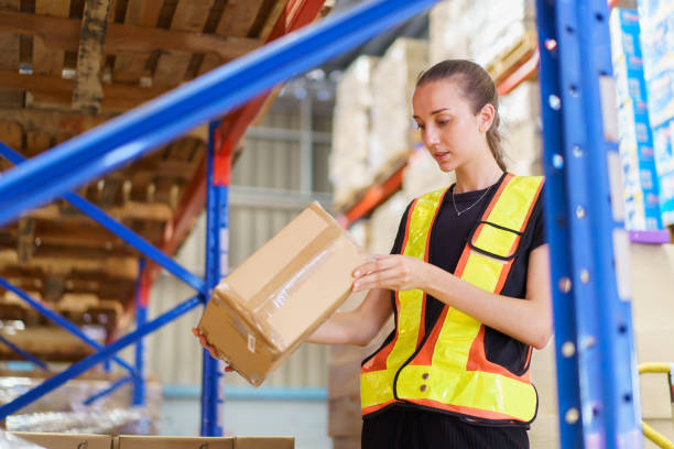 istock Female warehouse staff checking an items and inventory. 2157507749
