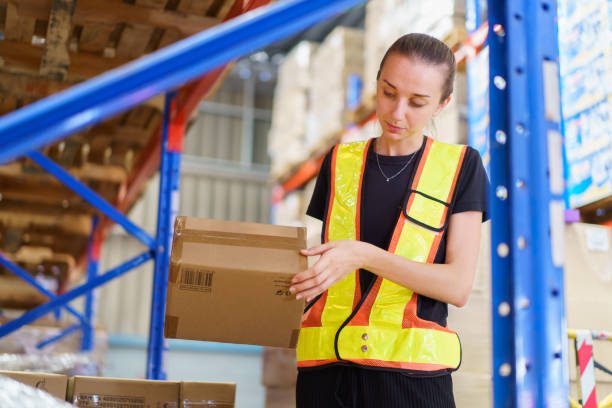 istock Female warehouse staff checking an items and inventory. 2157507750