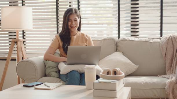 istock Asian young woman working from home,  e-learning at home 2157511181
