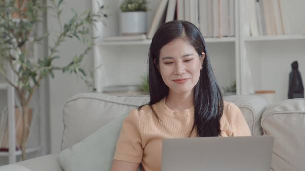 istock Asian young woman working from home,  e-learning at home 2157511315
