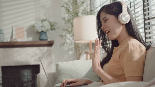 istock Asian young woman working from home,  e-learning at home 2157511940
