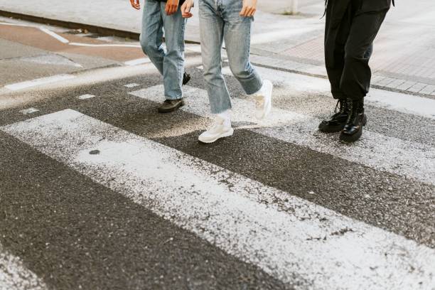 istock People crossing the zebra cross 2157512014