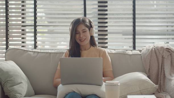 istock Asian young woman working from home,  e-learning at home 2157512138