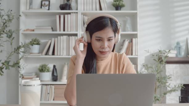 istock Asian young woman working from home,  e-learning at home 2157512165