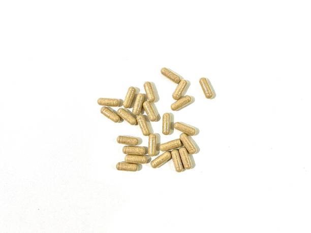 istock Herbal capsules isolated on white background 2157512338