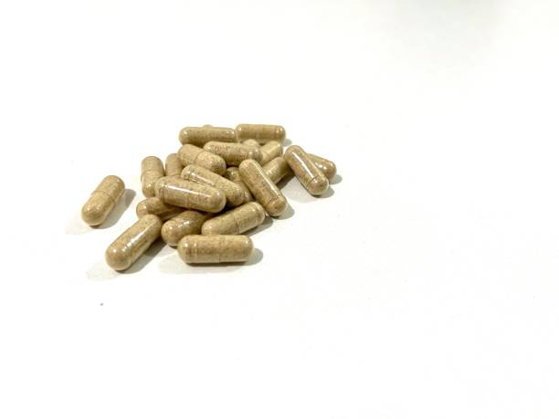 istock Herbal capsules isolated on white background 2157512339